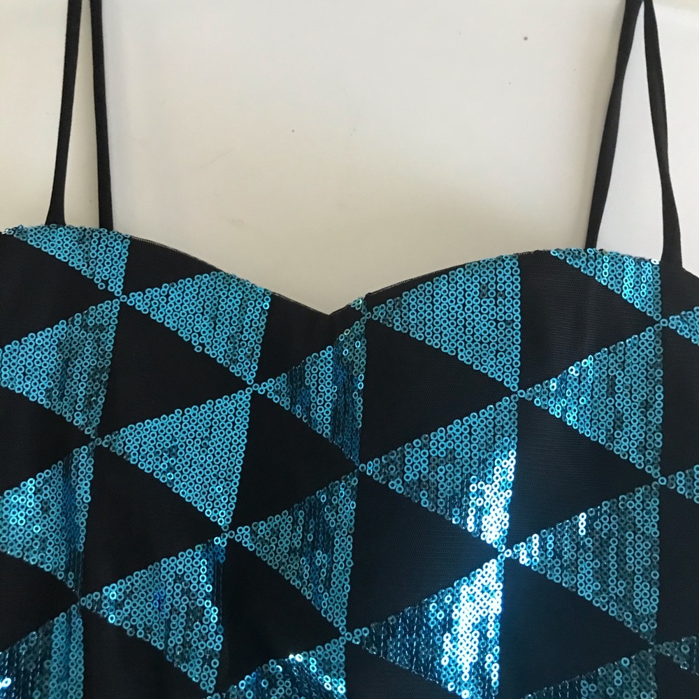 Spaghetti strap stretch beaded net jersey dress.